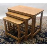 Robert Mouseman Thompson of Kilburn - a nest of three oak tables, rectangular adzed tops on