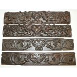 Two late C18th oak drawer fronts, carved with scrolls, cherubs and exotic beasts, and two similar