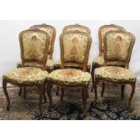 Set of six early C20th continental walnut framed dining chairs with upholstered seats and backs,