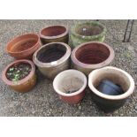Collection of eight various terracotta planters, some painted with floral designs