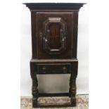 C17th Dutch oak and marquetry cupboard, cornice above single geometric moulded door revealing