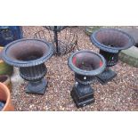 Pair of cast garden urns (one A/F) 50cm x 44cm, single cast garden urn 50cm x 29cm (3)