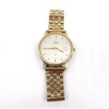 1990's Garrard 9ct gold quartz wristwatch with date, signed cream dial with applied baton hours