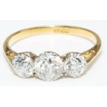 18ct yellow gold diamond ring, the large brilliant cut central diamond flanked by two smaller