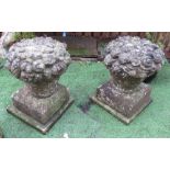The Grange Goathland - Pair of stone garden ornaments, in shape of vase of flowers, on plinths -