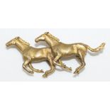 9ct yellow gold brooch in the form of galloping horses, by Alabaster and Wilson, stamped 9 375, 19.