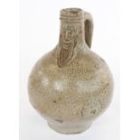 C17th German Bellarmine or Bartmannskrug bottle, likely Frechen region, of typical form with