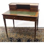 Edwardian satinwood banded mahogany writing table, brass galleried back with four drawers above