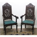 Pair of late C19th Kashmir carved hardwood Chinese style open armchairs, pierced dragon carved backs