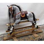 Carved wood swing rocking horse in rocking horse grey with associated tack, overall H85cm