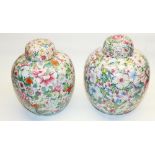 Large pair of C20th Japanese pottery Ginger jars and covers, ovoid bodies profusely decorated with