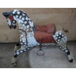 Victorian carved wood rocking horse (lacking swing base) with traces of original tack in dapple