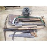 The Grange Goathland - Collection of various tools including saws, pickaxe, spades, shovels, roll of