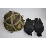 A British Army combat helmet Mk6 and a pair of British Army Northern Ireland black leather patrol