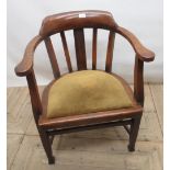 Early 20th century oak office armchair, with raised splat back and drop in seat on square tapering