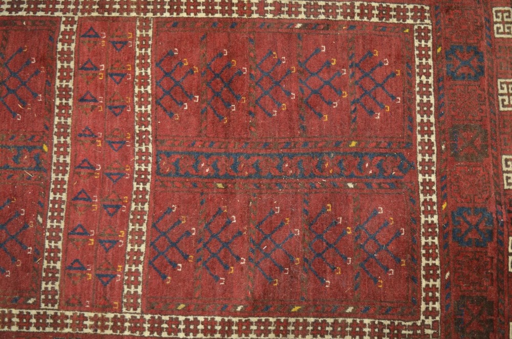 C20th Beshir style red ground wool rug, with patterned central field and geometric patterned border, - Image 3 of 3