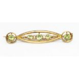 9ct yellow gold Art Nouveau brooch set with peridot and seed pearl, stamped 9ct, L5cm, 3.1g