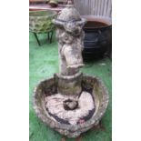 Reconstituted stone water fountain with floral design and basket