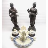 c. C19th spelter figures of ladies, one with a flower basket, the other accompanied by three