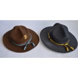 A US Army broad brimmed campaign hat with cap badge. US size 7.5, US made and "The Lawman",