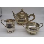hallmarked Sterling silver part tea service including a teapot, milk jug and sugar bowl, by Adie