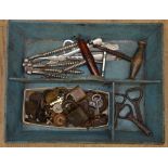 Collection of vintage padlocks with keys, corkscrews, nutcrackers, bottle openers in metal