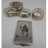 Iraqi white metal card case with niello decoration of a man on a camel, with Arabic mark, and a