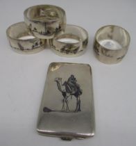 Iraqi white metal card case with niello decoration of a man on a camel, with Arabic mark, and a