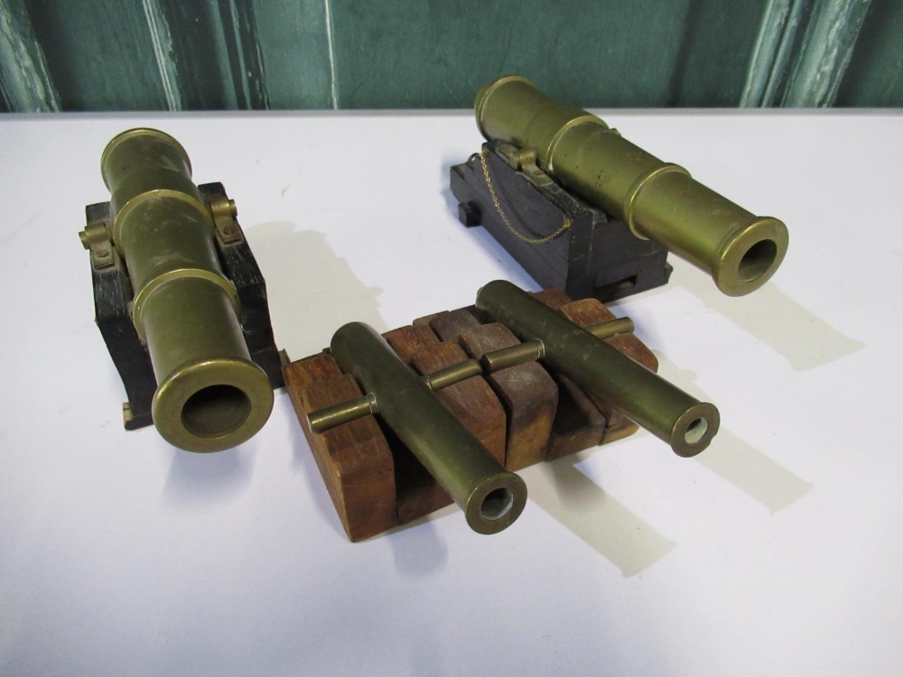Pair of 7 1/2" bronze model naval guns and pair of smaller model cannons (4)