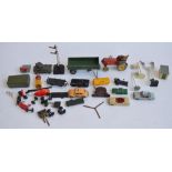 A vintage Dinky Toys die-cast Massey Harris tractor with driver and a trackless tank model. Also a