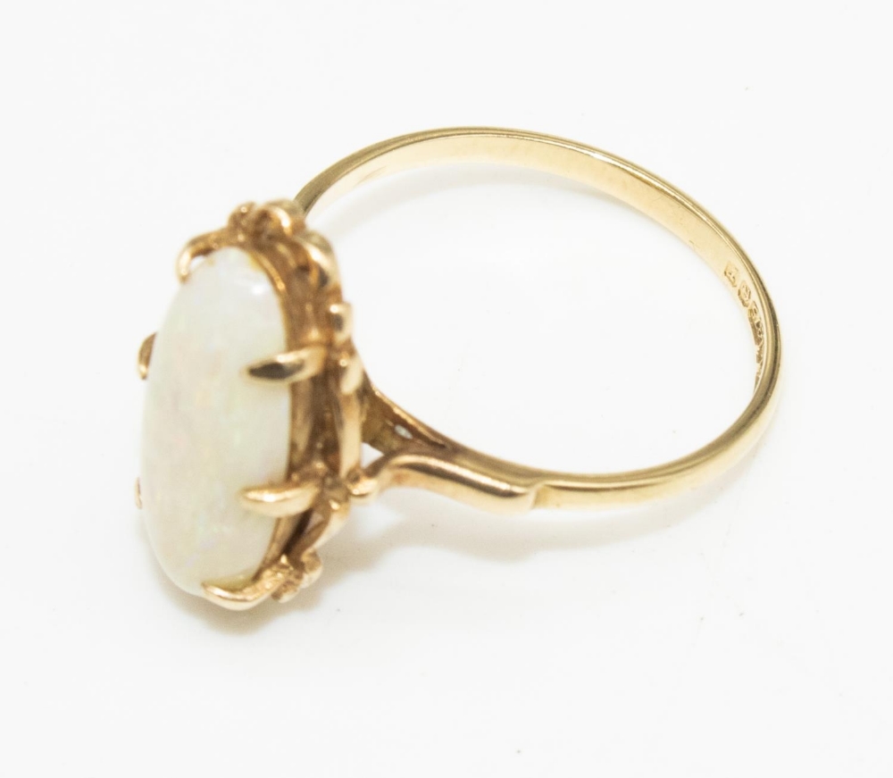 9ct yellow gold ring set with oval opal in scroll setting, stamped 375, size M1/2, 2.5g
