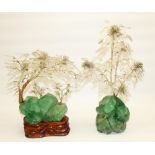 Two C20th polished quartz rock sculptures, wire branch work with glass leaves and beaded stamen, one