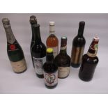 Bottle of Moet & Chandon, unnamed bottle of champagne, other wines and beers including House of