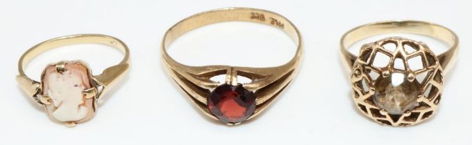 9ct yellow gold cameo ring, size K1/2, a 9ct yellow gold ring set with red stone, and a 9ct yellow
