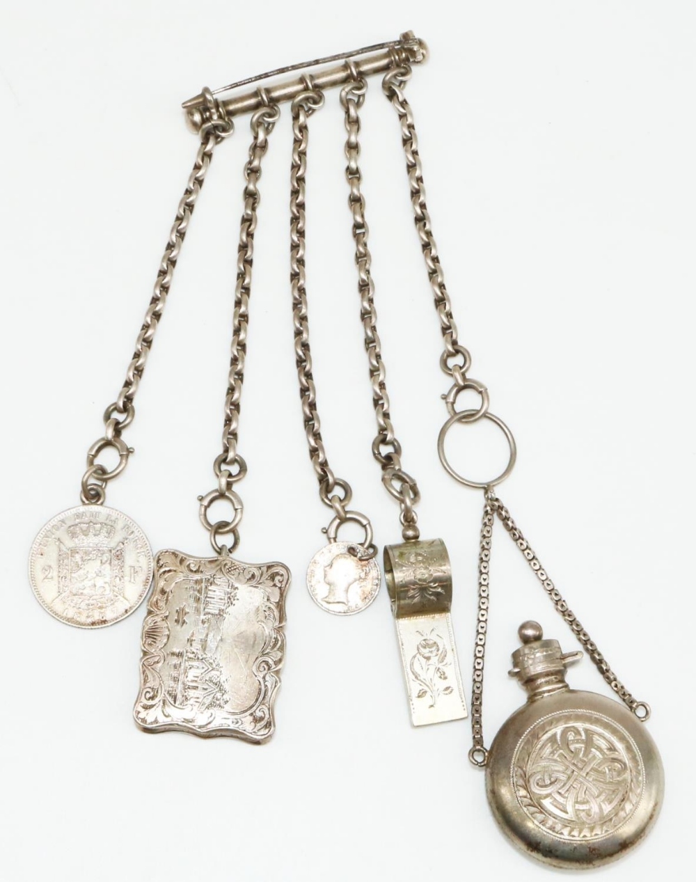 White metal chatelaine, with attached Victorian hallmarked Sterling silver vinaigrette, the