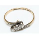 9ct yellow gold and platinum ring with three brilliant cut illusion set diamonds, stamped 9ct