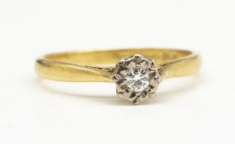 18ct yellow gold diamond solitaire ring, the brilliant cut diamond set in illusion mount, stamped