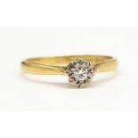18ct yellow gold diamond solitaire ring, the brilliant cut diamond set in illusion mount, stamped