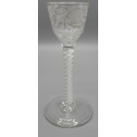 An English wine glass, ogee shaped bowl wheel engraved with flower and foliage, cotton twist stem,