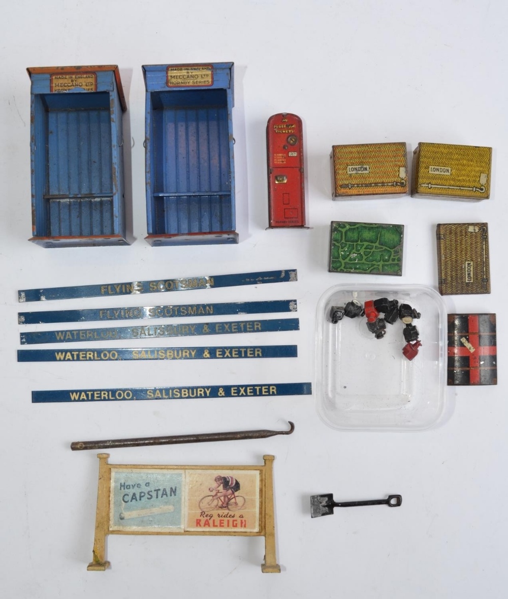 A collection of pre-war Meccano and Hornby tin plate and cast metal O gauge accessories.