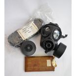 An ex-British Army Avon 1990 twin port gas respirator with 2 cartridges (appears unused), a set of