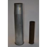 2 spent artillery shell cases. larger shell case size: Diameter 14.7cm Height 61cm. Smaller shell