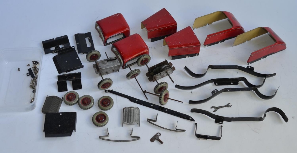 2 disassembled vintage Chad Valley Ubuilda tinplate clockwork Burnett 2 door coupe models. A/F,