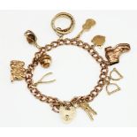 9ct yellow gold charm bracelet with heart padlock clasp, stamped 375, with charms including