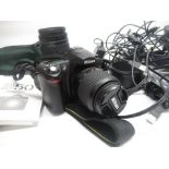 Nikon D50 Camera, Nikon AF Nikkor 70-300mm lens, small camera tripod, battery chargers, SD cards,