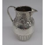 Victorian hallmarked Sterling silver milk jug with repousse fruit detail, rope twist handle and