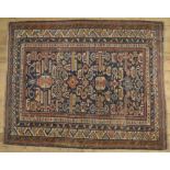 C20th Caucasian style wool rug, blue ground with central patterned field surrounded by geometric