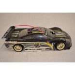 A 1/10 scale Mugen Seiki MTX-3 nitro powered radio control car (with instruction manual) with an HPI