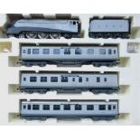 Boxed R2445 LNER 4/6/2 locomotive class a4 quick silver, 2 jubilee coaches, 1 silver break coach.