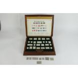 The Stamps of Royalty - cased set of twenty five sterling silver replica stamps, together with eight
